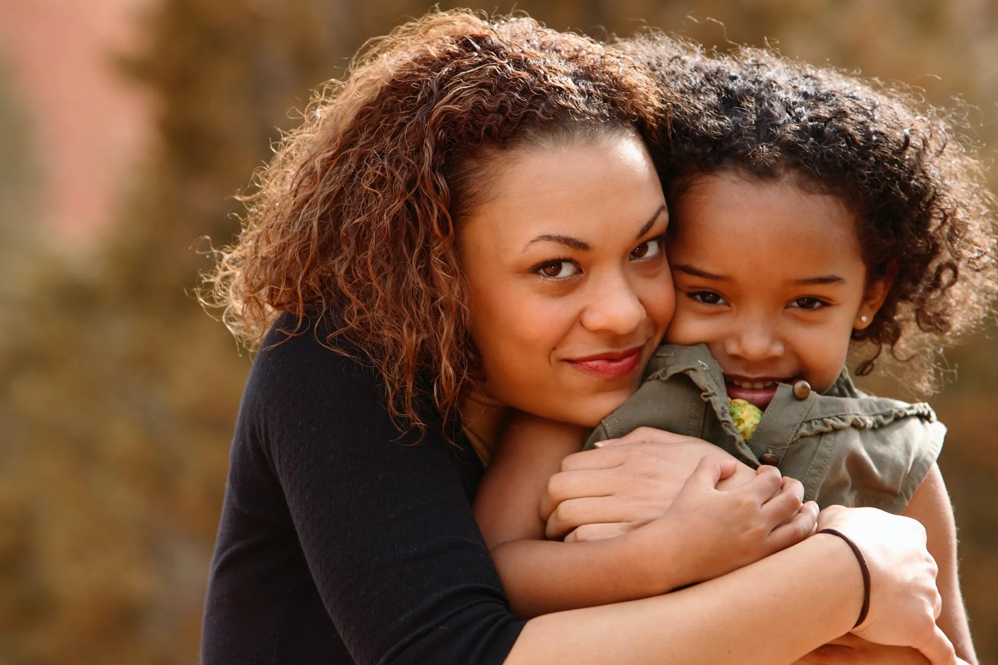 a woman and child hugging