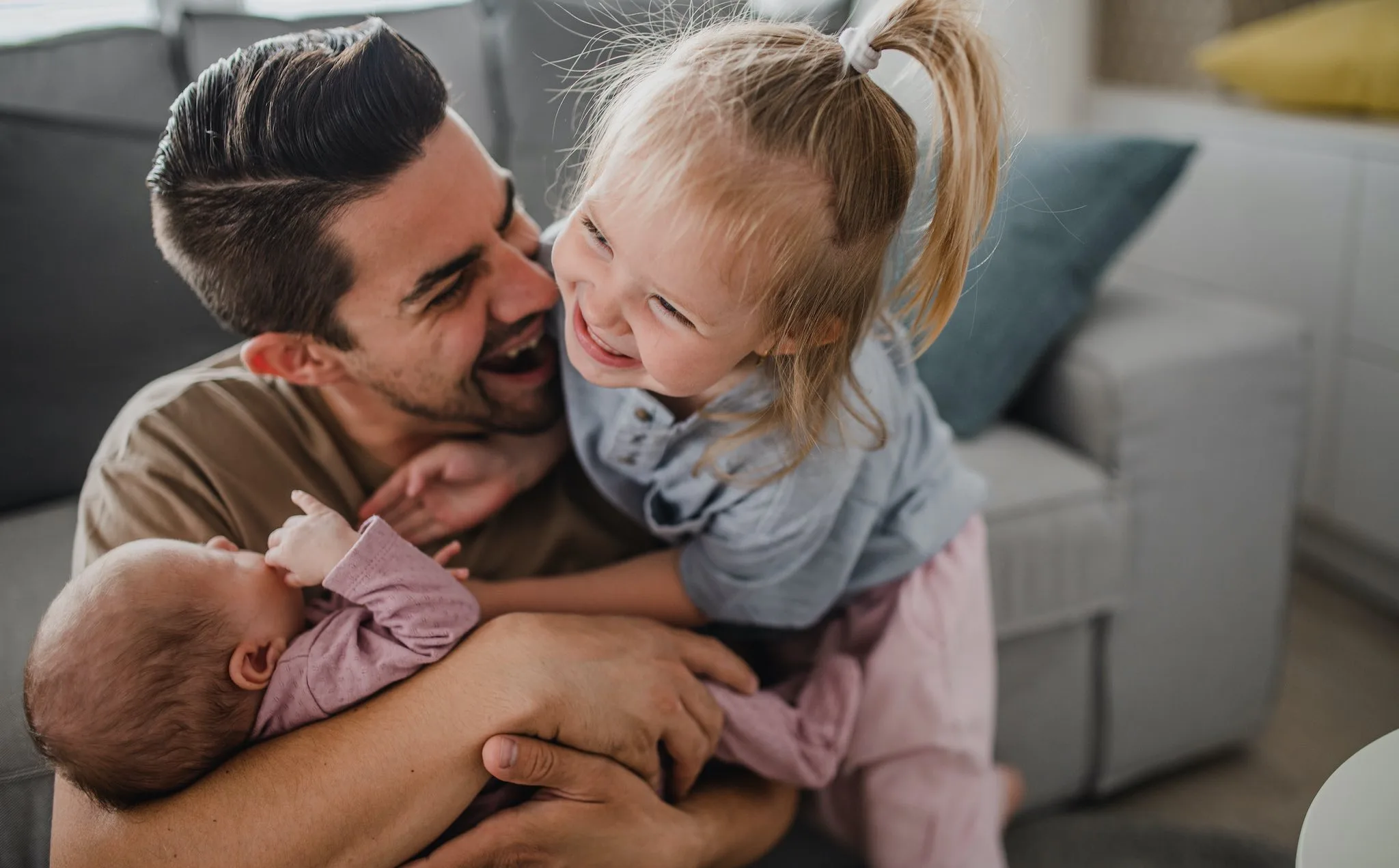 a man holding a baby