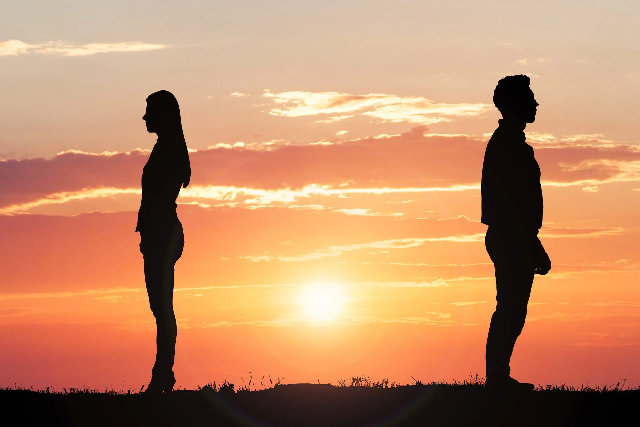 a silhouette of a man and woman